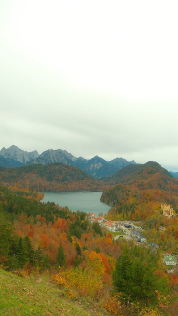 View of Alpsee lake and the Alps from above Neuschwanstein Castle in fall