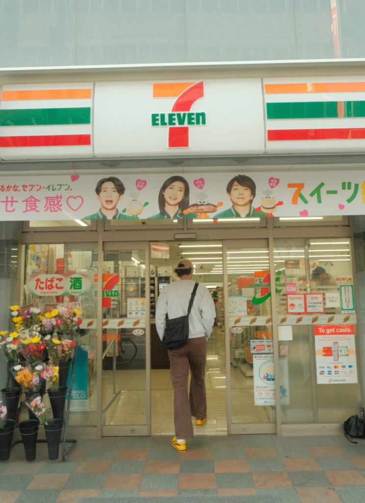 Man walking into 7 eleven store in Tokyo, Japan