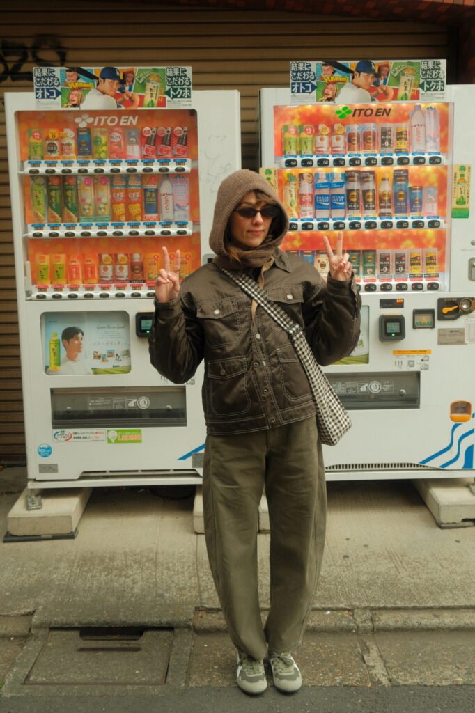 Woman in front of vending machine in Tokyo, Japan