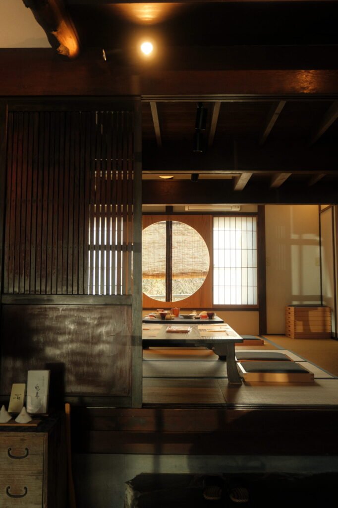 restaurant with wooden furnishings and circular window in Hakone, Japan