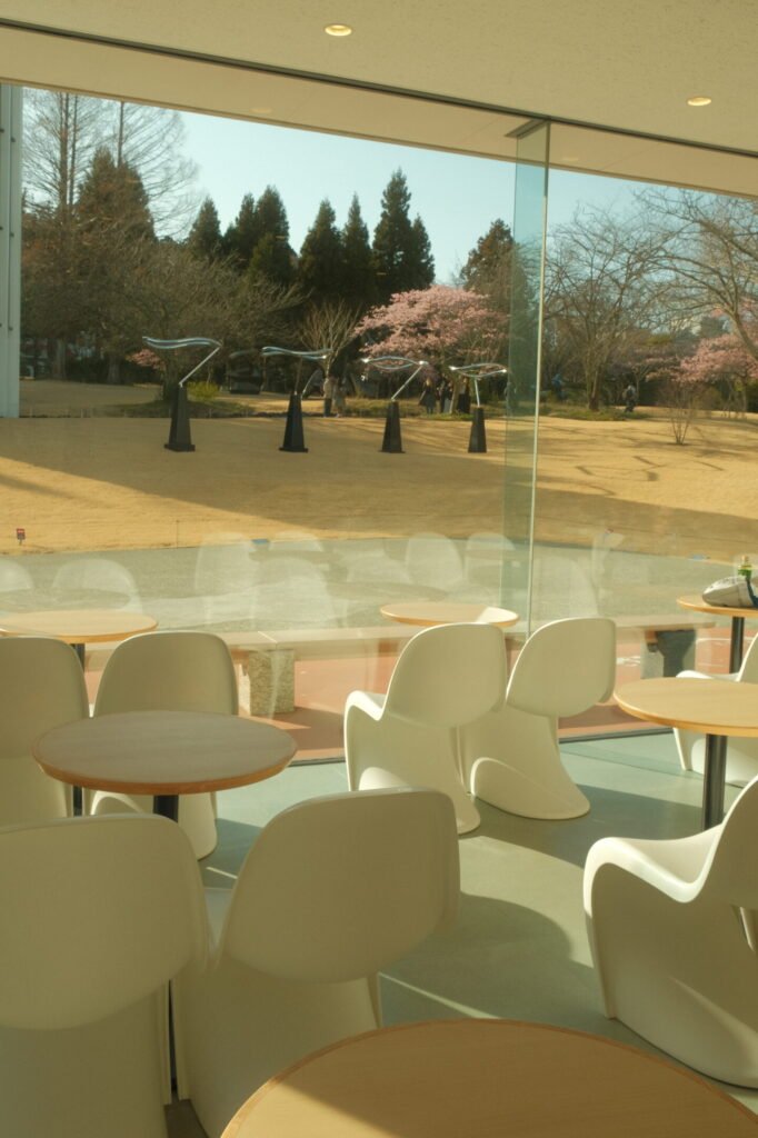 Modern white chairs in front of windows at the Hakone Open Air Museum