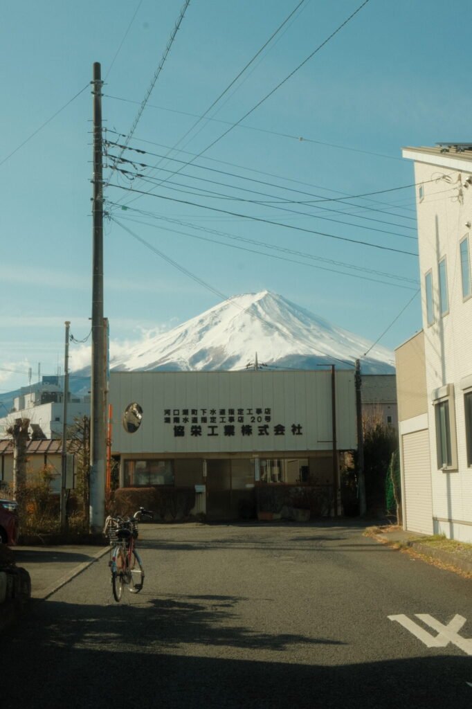 Bike and building in front of Mount Fuji, Japan in Fujikawaguchiko