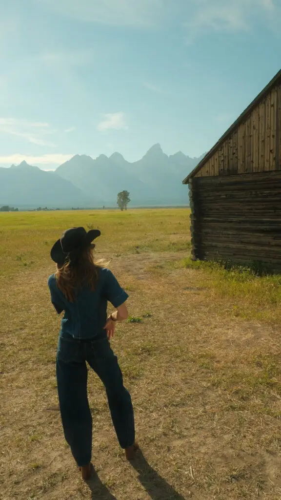 Woman in cowboy hat at Mormon Row in Grand Teton National Park, Wyoming