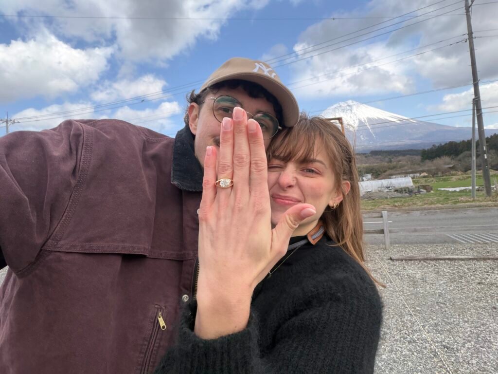 Couple with engagement ring in front of Mount Fuji, Japan