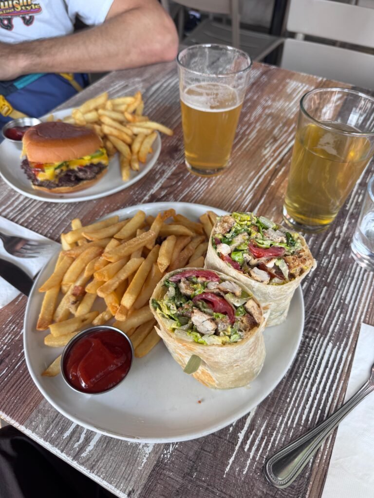 Chicken Caesar wrap, burger, and beer at Revelry in Bozeman, Montana
