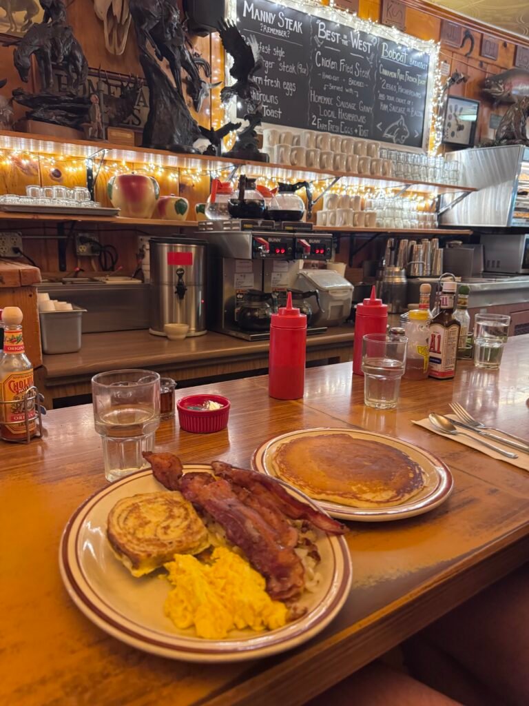 Breakfast plate with bacon, eggs and a pancake at Western Cafe in Bozeman, Montana