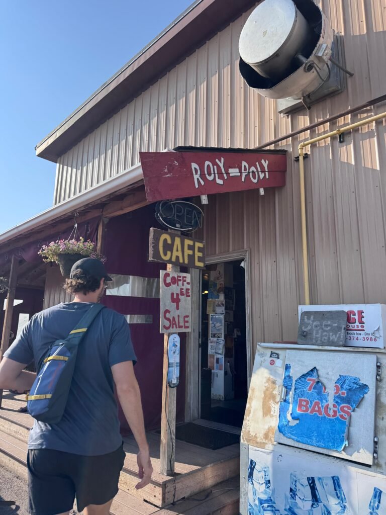 Man walking into Roly Poly coffee shop in Bozeman, Montana