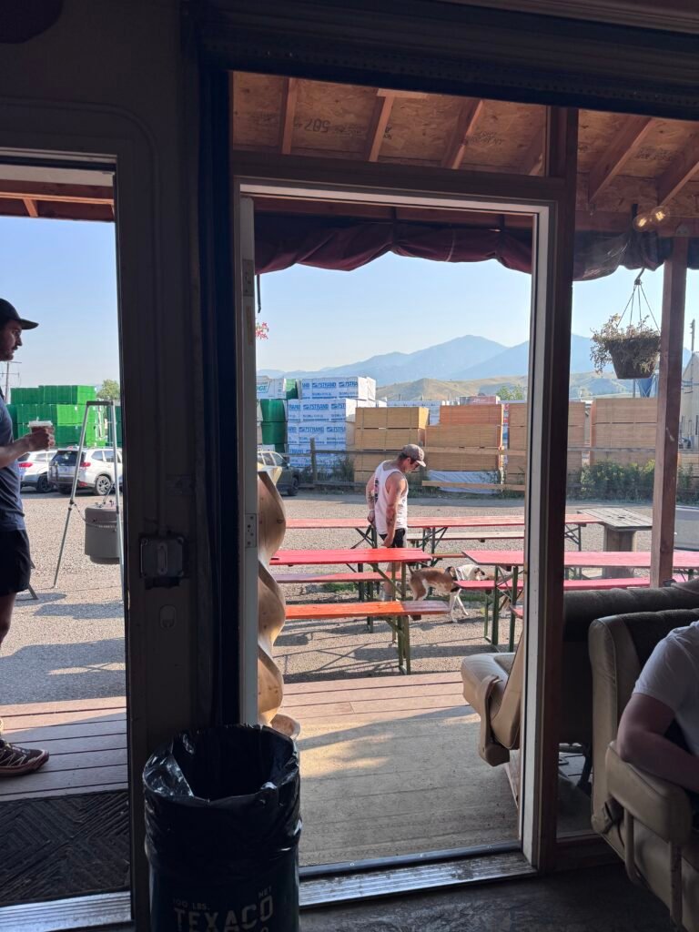 picnic tables overlooking mountains at Roly Poly Coffee in Bozeman, Montana