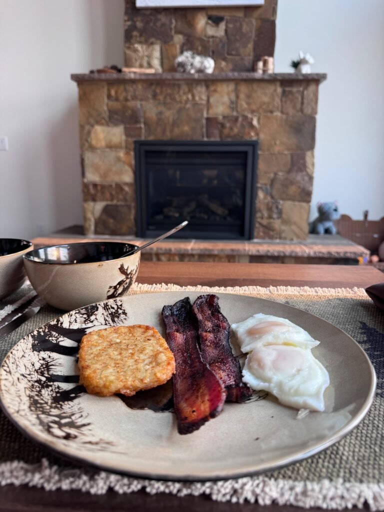 Breakfast plate of eggs, bacon, and biscuit at the Airbnb in Driggs, Idaho